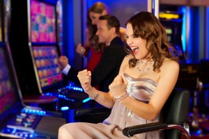 girl-on-a-slot-machine-all-obviously-are-winning-in-Las-Vegas-casino-Nevada-1600x1066