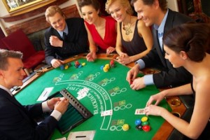 Friends playing cards on blackjack table